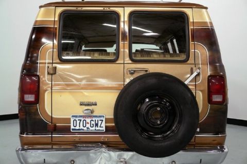 1978 Ford E250 - Rear view of a custom van painted in a brown-and-gold fade with pinstriping, showing tinted windowed barn doors, an 'Econoline' badge, red…