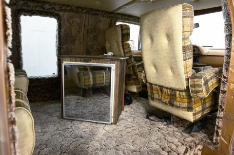 1978 Ford E250 - Interior of a 1978 Ford E250 van, custom plaid upholstery and a built-in refrigerator.