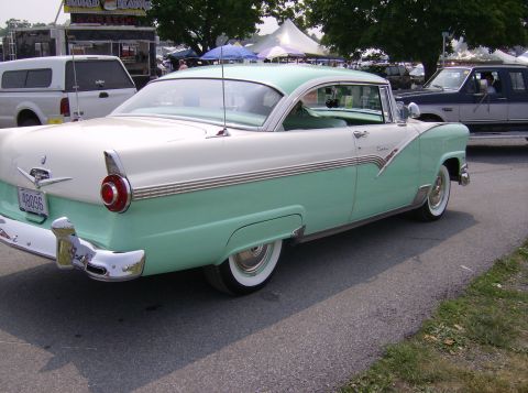 1970 Ford Ranchero - A classic two-tone green and white 1955 Ford Fairlane Crown Victoria is seen from the rear quarter angle.