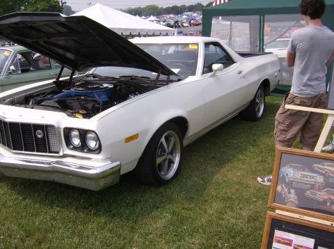 1970 Ford Ranchero - 1970 Ford Ranchero on display at an outdoor car show, hood raised to reveal the engine.