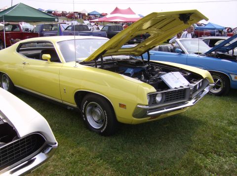 1970 Ford Ranchero - 1970 Ford Torino GT on display at a car show, hood open revealing the engine bay.