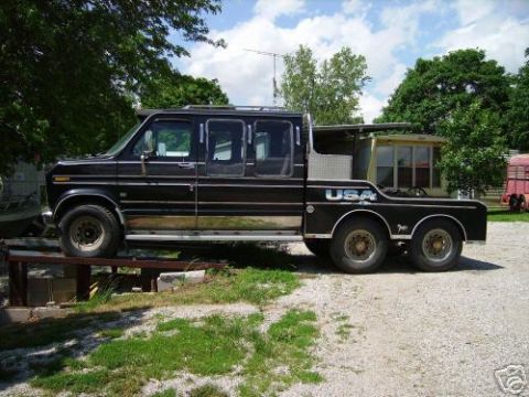 1978 Ford E250 - This custom van has been modified with an extended cab and a flatbed truck rear end.