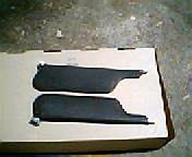 1973 Ford Ranchero - A pair of car sun visors are shown resting on a cardboard box.
