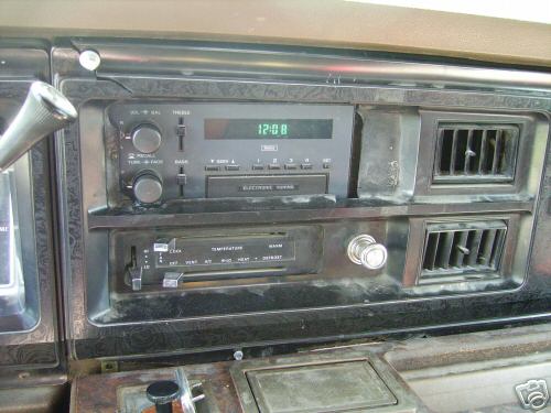 1978 Ford E250 interior dashboard with digital clock radio and climate controls