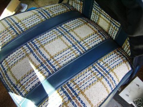 1978 Ford E250 - The plaid and blue vinyl seat upholstery is visible in this interior shot.