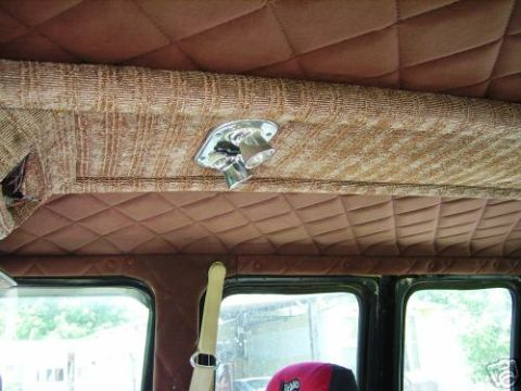 1978 Ford E250 - Interior view of a van quilted brown upholstery and a chrome dome light.