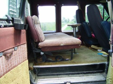 1978 Ford E250 - Van interior with passenger seats and windows visible, view of the open road outside.