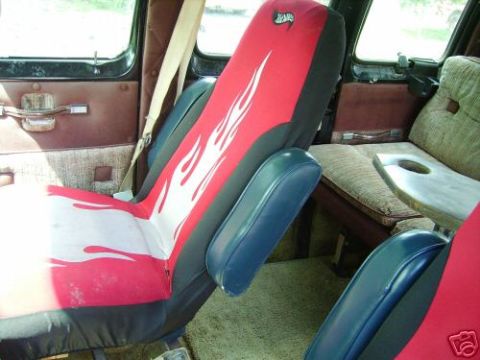 1978 Ford E250 - Custom flame seat covers and a table are visible inside this van's interior.