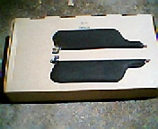 1973 Ford Ranchero - Two black sun visors are presented inside a cardboard box, likely for a vehicle.
