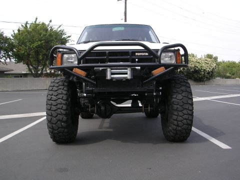 1985 Toyota 4Runner - This 1985 Toyota 4Runner features a prominent front winch and a heavy-duty bull bar, suggesting off-road modifications.
