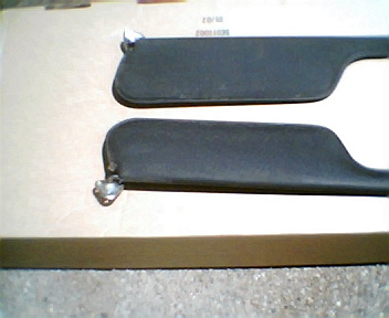 1973 Ford Ranchero - Two sun visors are shown, likely for an automotive interior, with visible mounting hardware and a SuperMotors watermark.