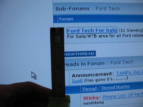 1997 Ford Crown Victoria - A ruler and hand obscure part of a computer screen displaying a Ford Tech forum.