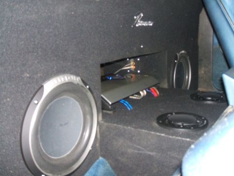 1974 Ford Ranchero - The rear of the vehicle is outfitted with a custom sound system, including multiple speakers and an amplifier.