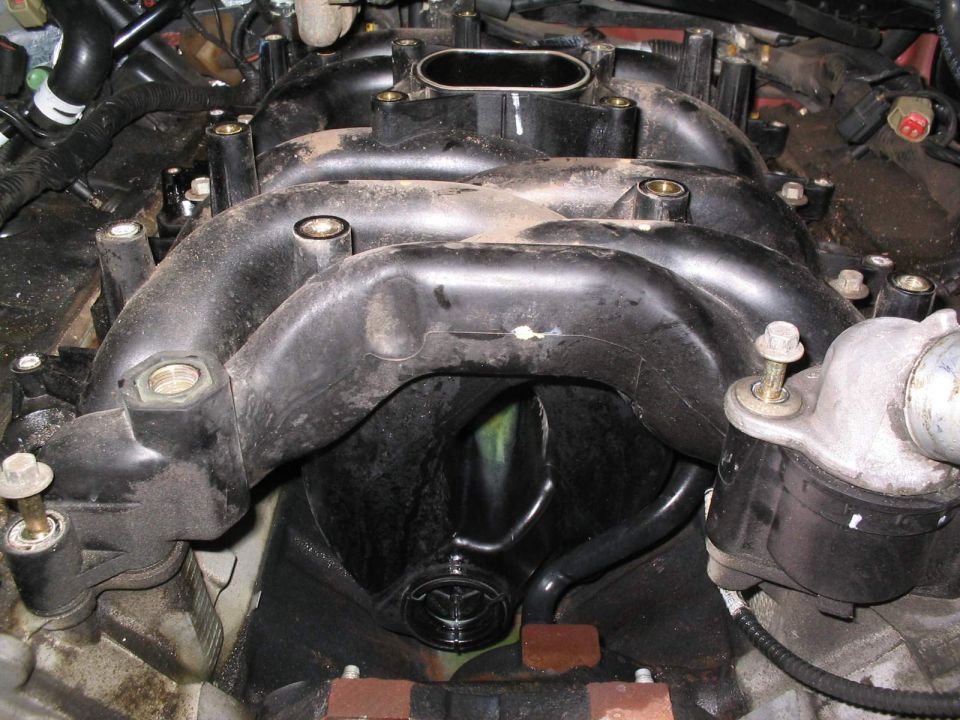 Engine intake manifold with visible Toyota logo