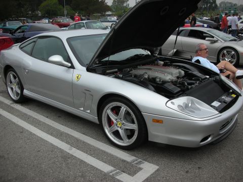 1998 Ford Crown Victoria - Silver Ferrari 550 Maranello at a car meet, engine exposed for viewing.