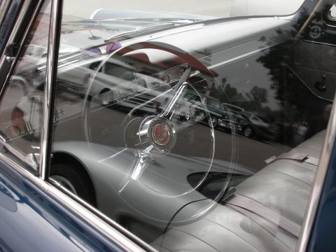 1998 Ford Crown Victoria - Interior view of a classic car, likely from the 1950s, with reflections of other vehicles visible.