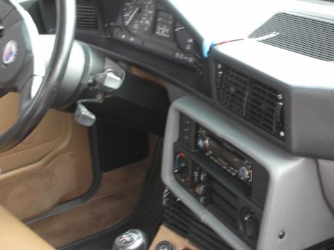 1998 Ford Crown Victoria - Interior view of a car's dashboard, steering wheel, and center console.