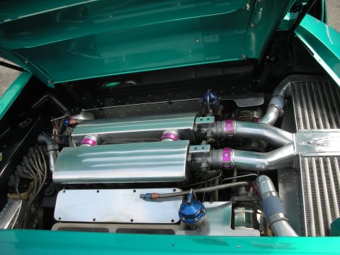 1998 Ford Crown Victoria - Custom engine bay features twin turbochargers and polished components, highlighting performance modifications.