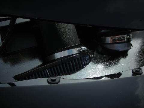 1998 Ford Crown Victoria - Close-up of an aftermarket air intake system, likely for an engine bay.