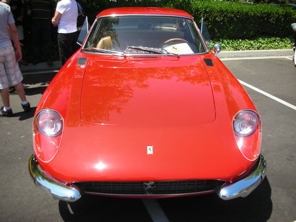 Red sports car with chrome bumper and round headlights