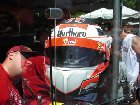 1998 Ford Crown Victoria - A Marlboro branded racing helmet, likely from a Ferrari driver, is displayed behind glass.