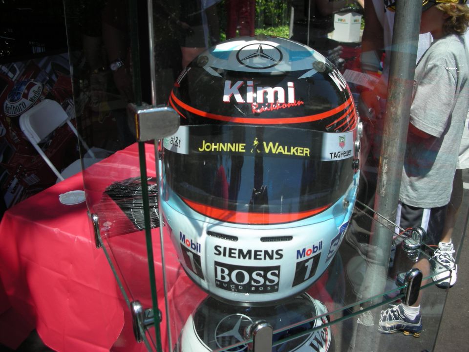Racing helmet with Kimi, Johnnie Walker, TAG Heuer, Mobil, Siemens, and Boss logos