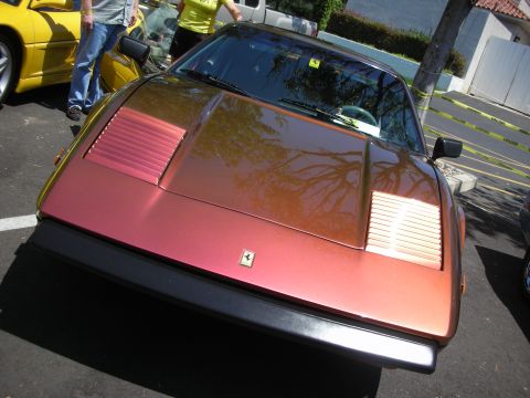 1998 Ford Crown Victoria - A Ferrari 308 GTB/GTS is parked next to a yellow sports car.