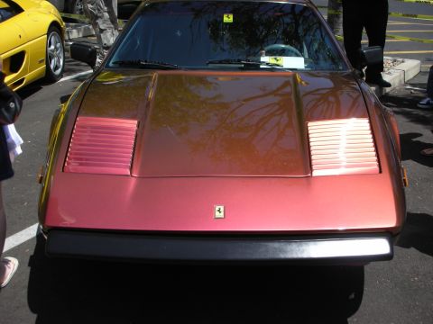 1998 Ford Crown Victoria - Front view of a Ferrari with a yellow Ferrari in the background.
