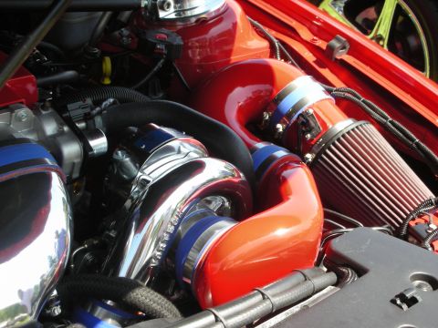 1998 Ford Crown Victoria - Close-up of a modified engine bay a turbocharger and custom intake system.