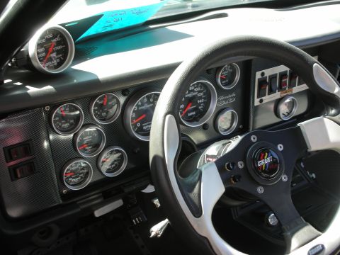 1998 Ford Crown Victoria - The dashboard features numerous aftermarket gauges and a Grant steering wheel, suggesting significant customization.