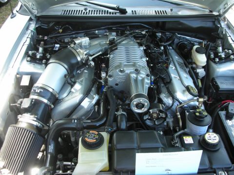 1998 Ford Crown Victoria - The engine bay features a large supercharger, indicating a performance-oriented setup.