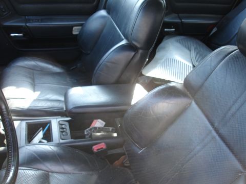 1991 Ford Taurus - Interior view of a 1991 Ford Taurus, highlighting the leather seats and center console.