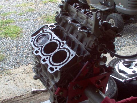 1996 Ford Probe - Engine block assembly, possibly for a turbo upgrade, is shown disassembled on a stand.