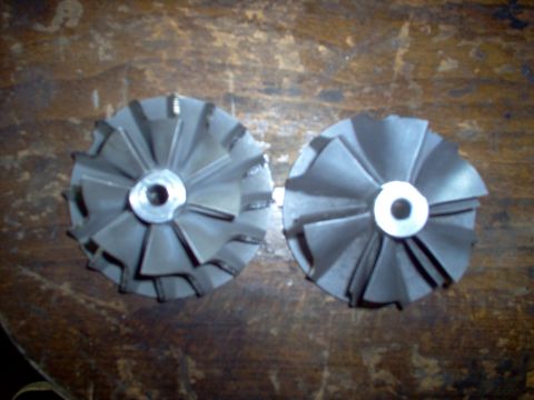 1996 Ford Probe - Two turbocharger compressor wheels are shown, likely for a performance upgrade.