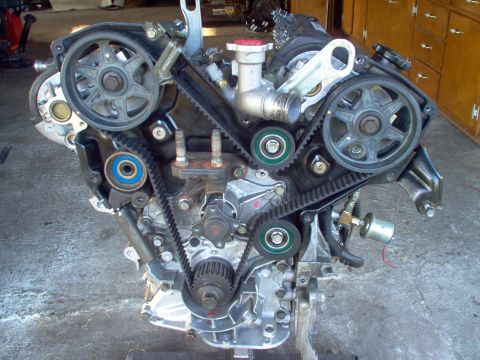1996 Ford Probe - Engine assembly with visible timing belts and pulleys, showing mechanical components.