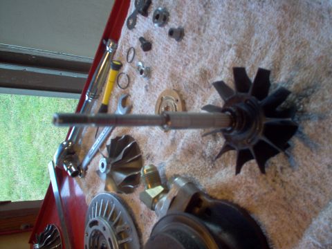 1996 Ford Probe - Disassembled turbocharger parts and tools are spread out on a towel, ready for maintenance or upgrade.