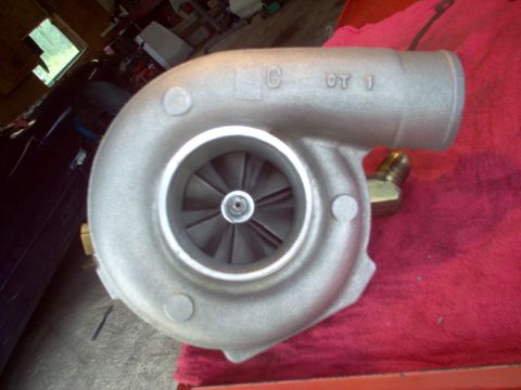 1996 Ford Probe - A close-up view of a turbocharger with visible markings on its housing.