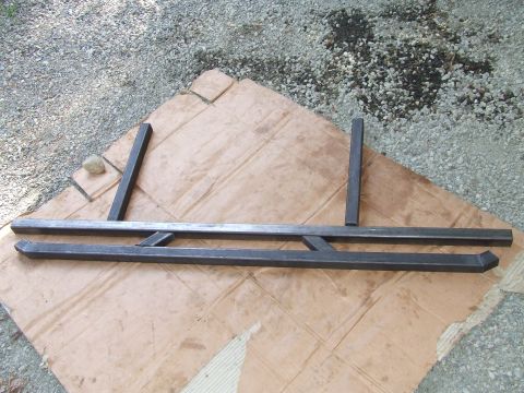 1979 Ford Bronco - Custom metal sliders, likely for an off-road vehicle, are shown laid out on cardboard.