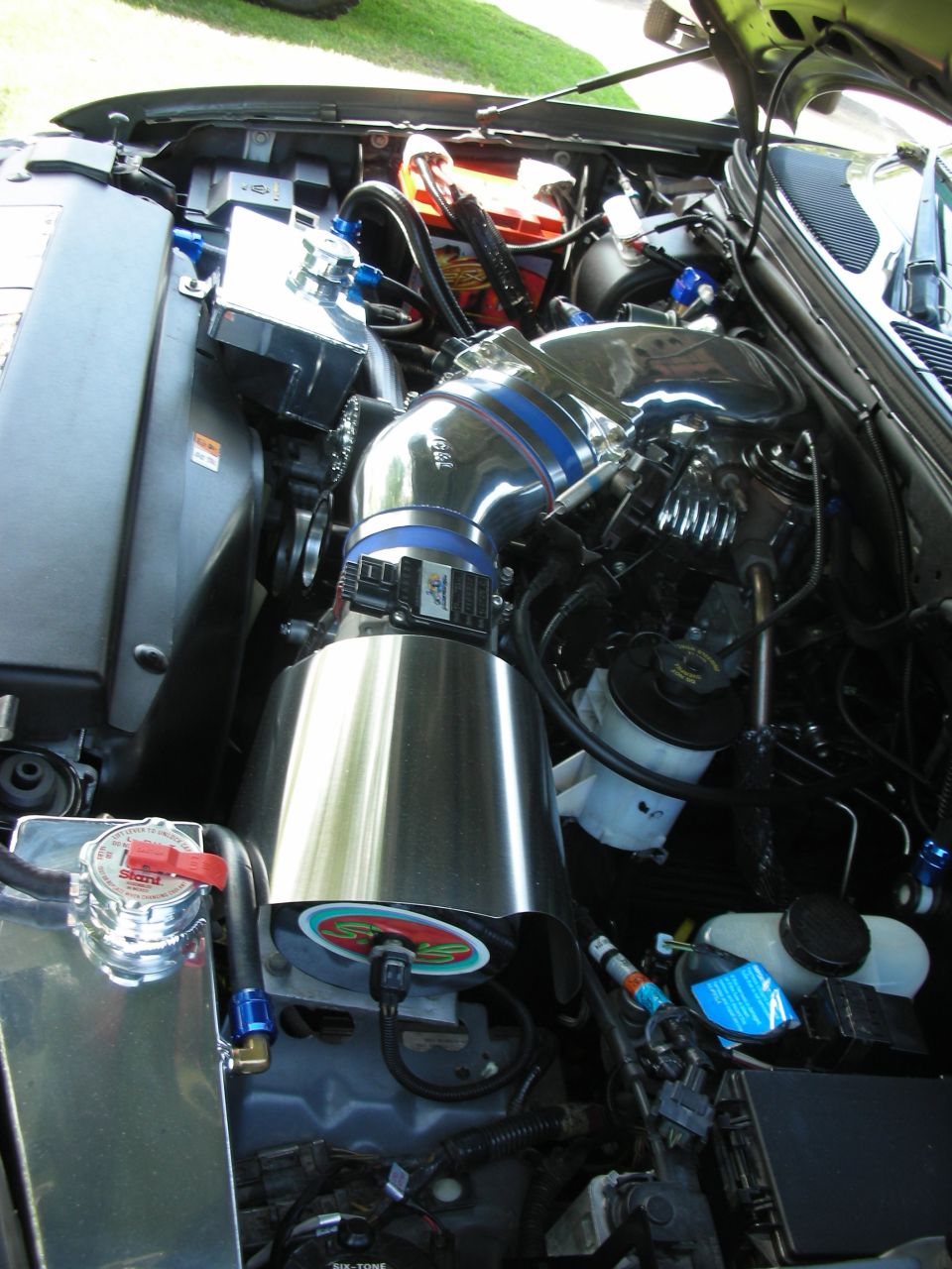 Engine bay with custom intake and chrome components