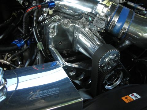 1998 Ford Crown Victoria - Close-up view of a highly polished engine bay, a supercharger and custom intake components.