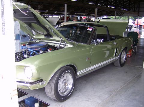 1970 Ford Ranchero - Green convertible with hood and trunk open, GT500KR badging visible.
