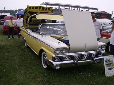 1970 Ford Ranchero - A yellow and white 1959 Ford Fairlane 500 Skyliner convertible is displayed with its hood and trunk open.