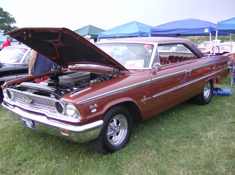 Brown 1963 Ford Galaxie 500 with hood open, showing engine. Chrome trim and wheels