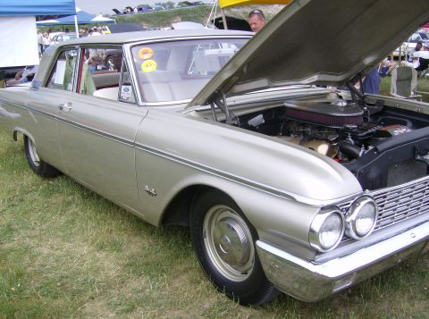 1970 Ford Ranchero - A classic silver Ford Fairlane is displayed with its hood open, revealing the engine compartment.