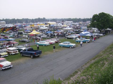 1970 Ford Ranchero - A large gathering of vintage automobiles are on display at an outdoor event.