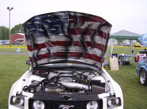 1970 Ford Ranchero - The underside of the hood is airbrushed with an American flag design, while the engine bay is visible.