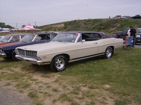 1970 Ford Ranchero - A classic Ford LTD is displayed outdoors at what appears to be a car show or gathering.