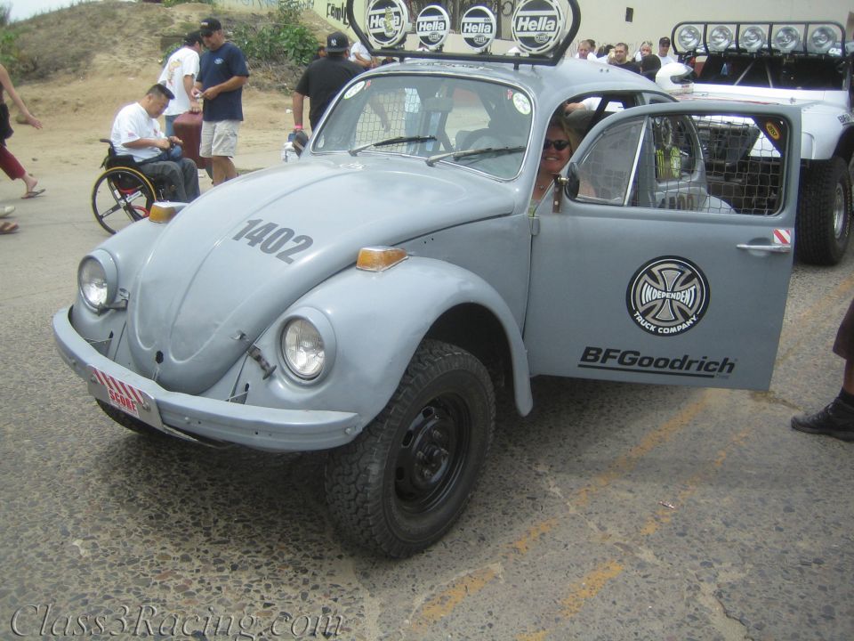 Gray Baja Volkswagen Beetle race car numbered 1402 with roof light bar