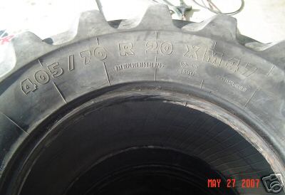 1991 Ford Bronco - A close-up view of a tractor tire shows the size marking 405/70 R 20 XM47.