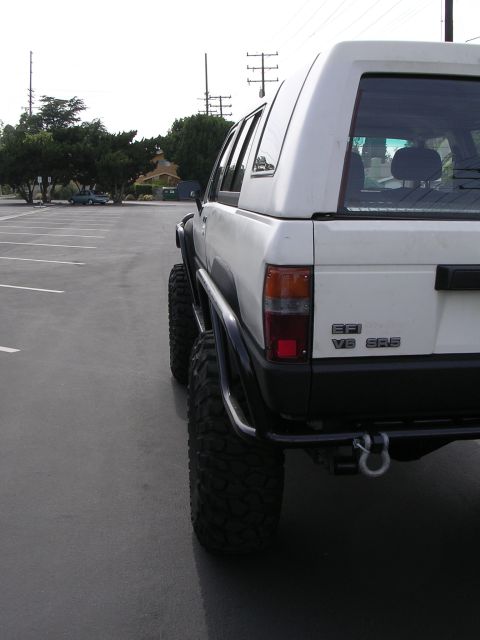 1985 Toyota 4Runner - Modified 1985 Toyota 4Runner with custom roll cage and large off-road tires.